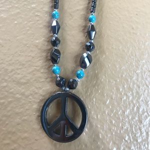 Gray stone w/til piece sign